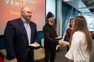 Homegrown Ventures Conference With Speaker Dylan Lloyd Shaking Hands With Event Host Heather Dufour